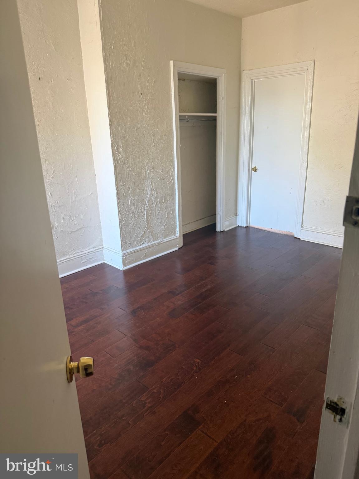 1234 Point Breeze Avenue Philadelphia, PA 19146 - Photo 3 of 15 an empty room with wooden floor and closet