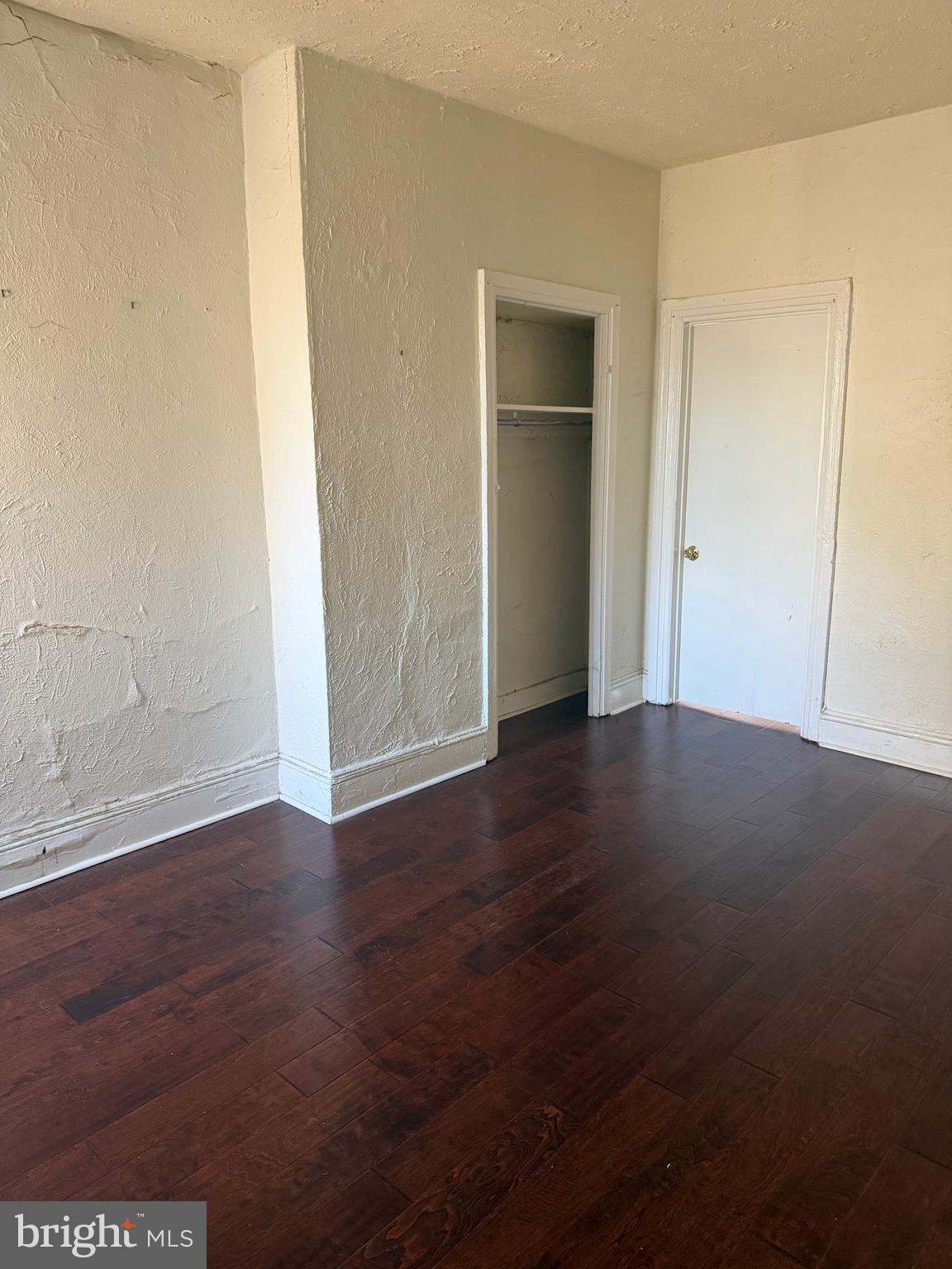 1234 Point Breeze Avenue Philadelphia, PA 19146 - Photo 5 of 15 an empty room with wooden floor and closet