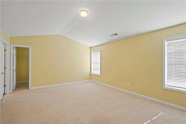 a spacious bathroom with a double vanity sink mirror and a bathtub