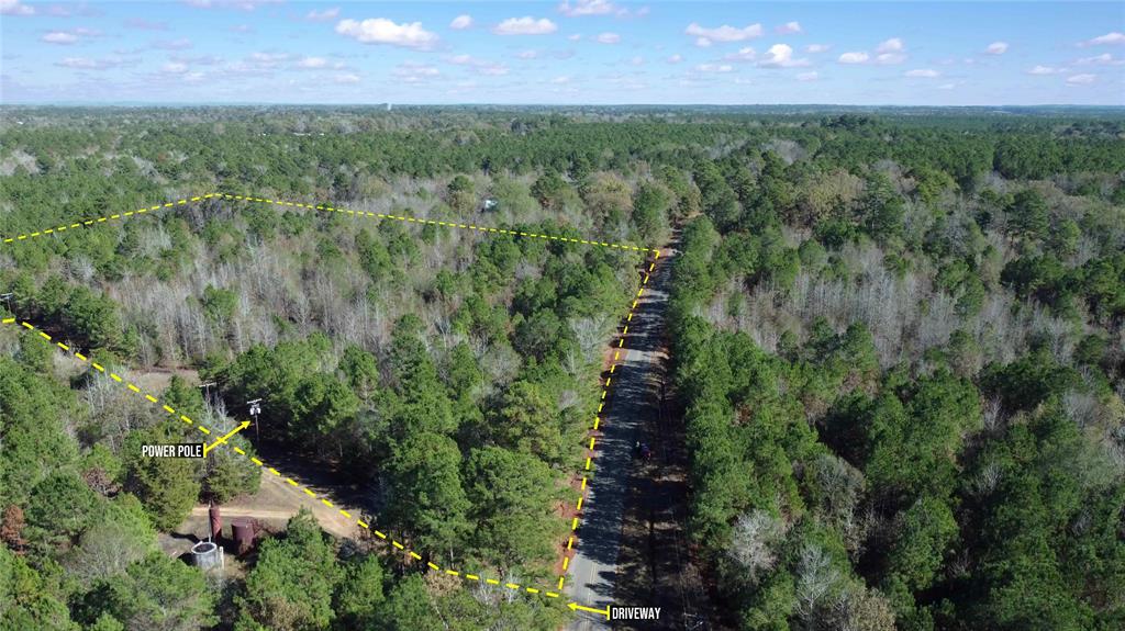 10714 Monterey School Road Vivian, LA 71082 - Photo 2 of 33 an aerial view of residential houses with outdoor space and trees all around