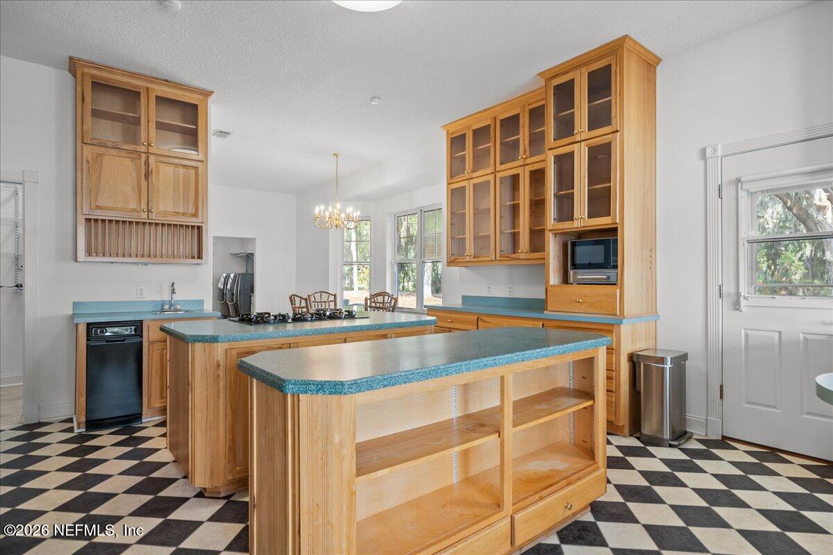 533 West River Road Palatka, FL 32177 - Photo 16 of 78 a kitchen with stainless steel appliances granite countertop a sink and a stove