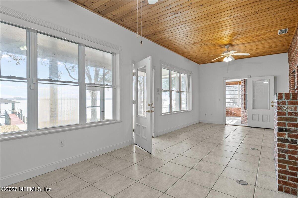 533 West River Road Palatka, FL 32177 - Photo 18 of 78 a view of an empty room with window and wooden floor
