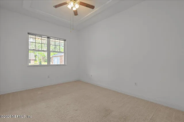 a spacious bathroom with a granite countertop sink a toilet and bathtub