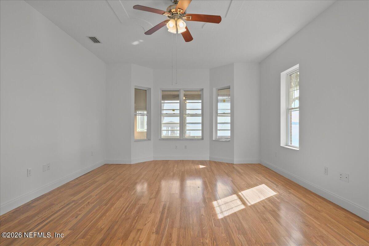 533 West River Road Palatka, FL 32177 - Photo 32 of 78 a view of an empty room with wooden floor and a window