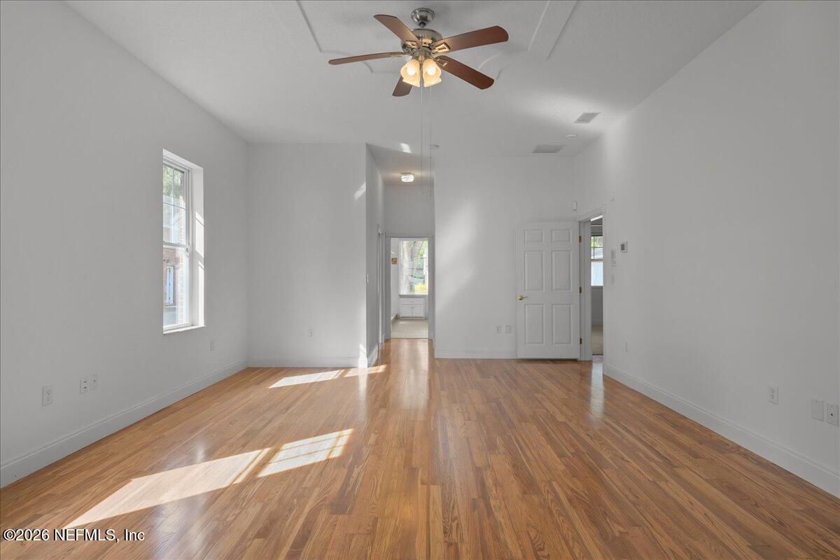 533 West River Road Palatka, FL 32177 - Photo 33 of 78 wooden floor in an empty room with a window