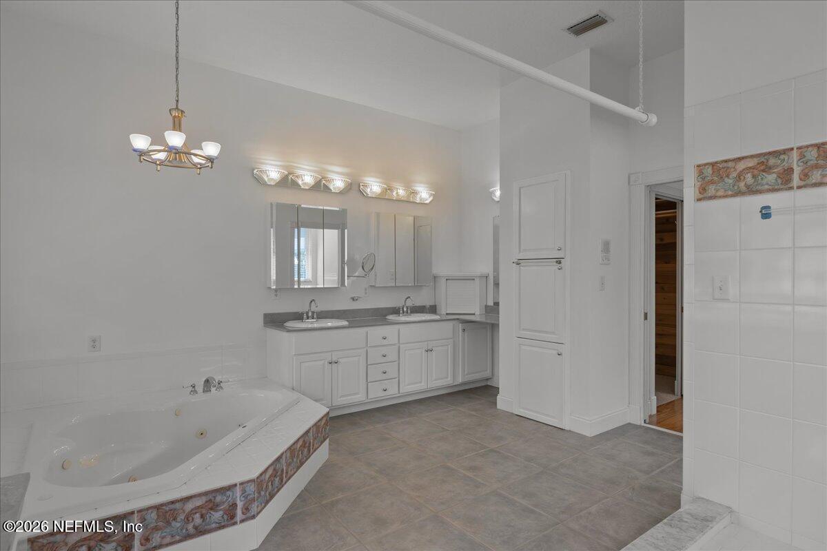 533 West River Road Palatka, FL 32177 - Photo 36 of 78 a spacious bathroom with a granite countertop sink a toilet and bathtub