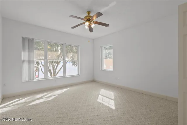 a view of a balcony with wooden floor