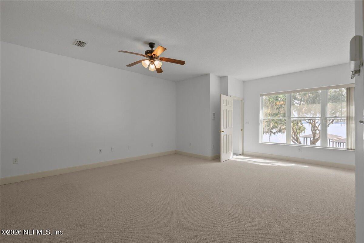 533 West River Road Palatka, FL 32177 - Photo 40 of 78 an empty room with windows and outer view