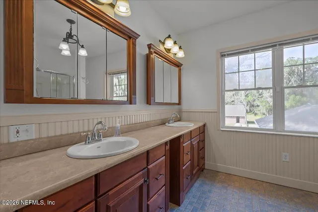 a view of a bathroom with a glass door shower