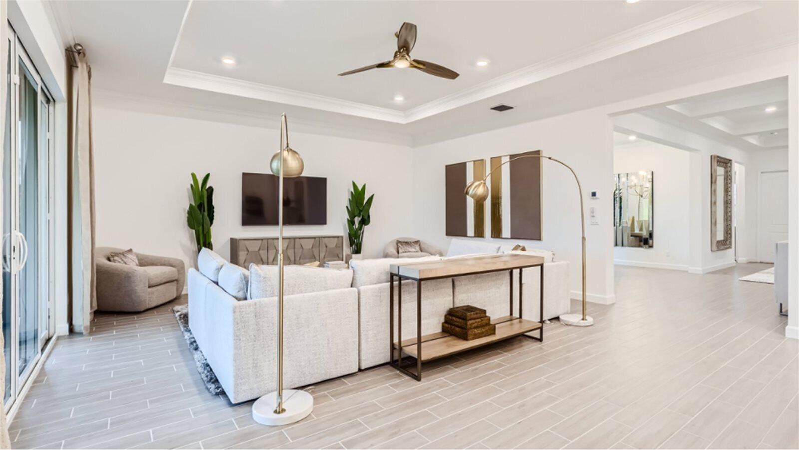 19005 Fly Rod Road Loxahatchee, FL 33470 - Photo 6 of 23 _Pic_Flora_GreatRoom_2of2_F1_1_20_24