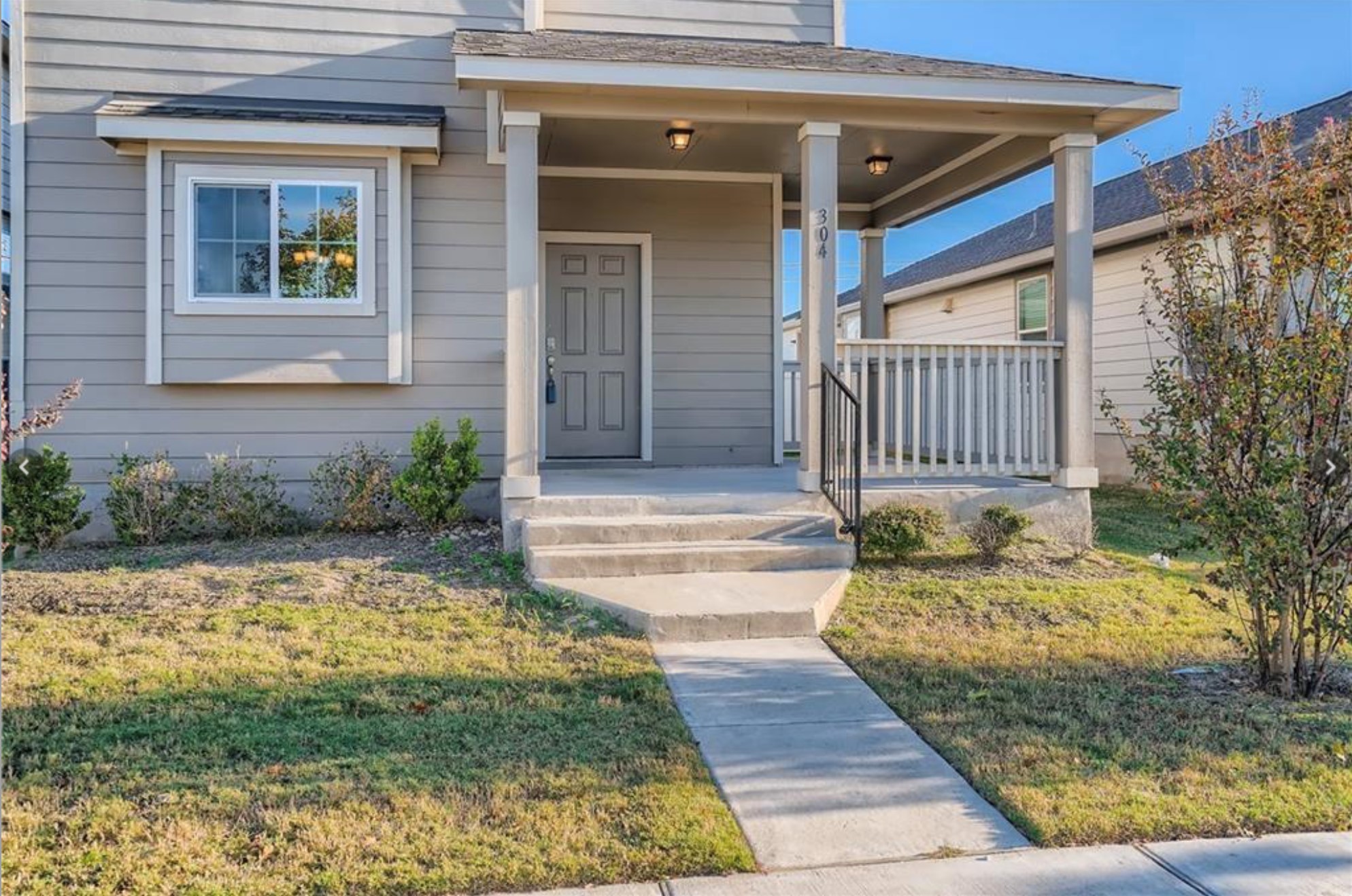 304 Cane River Road Pflugerville, TX 78660 - Photo 2 of 31 A welcoming front porch with classic columns invites entry to this charming residence.