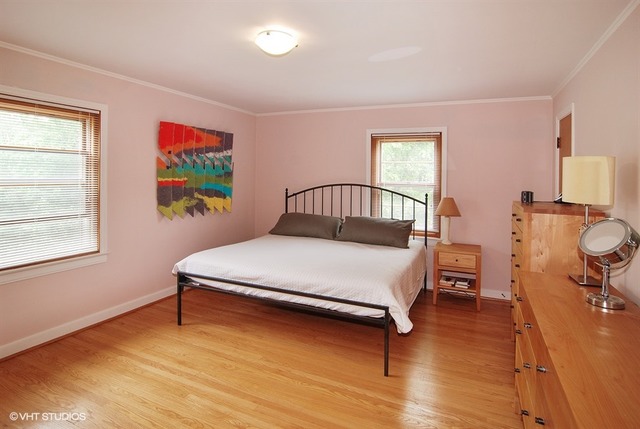 505 Nuttall Road Riverside, IL 60546 - Photo 8 of 15 a bedroom with a bed and wooden floor