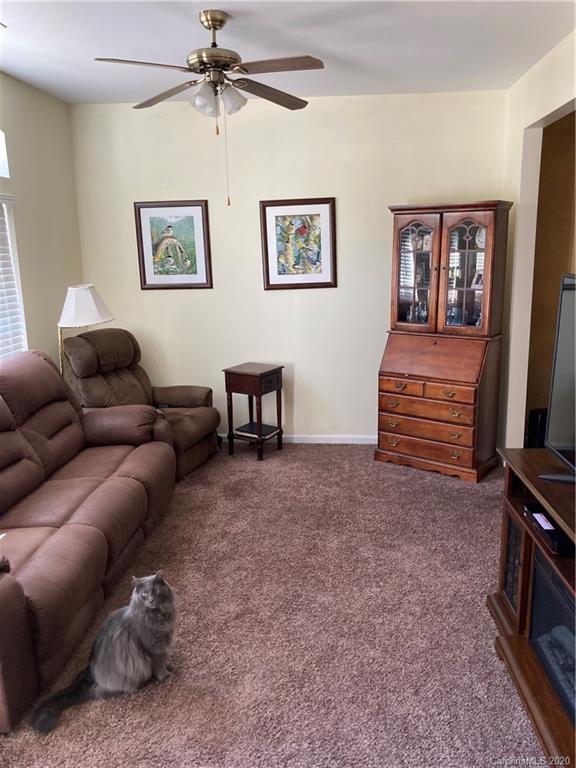 849 Dillard Road Rock Hill, SC 29730 - Photo 2 of 28 a living room with furniture a ceiling fan and a window