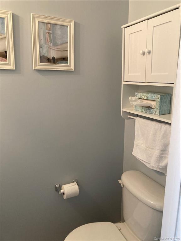 849 Dillard Road Rock Hill, SC 29730 - Photo 15 of 28 a white toilet sitting next to a bathroom sink
