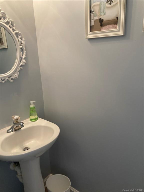 849 Dillard Road Rock Hill, SC 29730 - Photo 16 of 28 a bathroom with a sink and a mirror