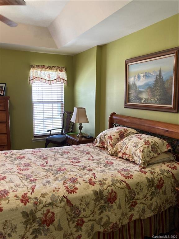 849 Dillard Road Rock Hill, SC 29730 - Photo 20 of 28 a bedroom with a bed and wooden floor