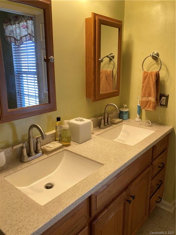 849 Dillard Road Rock Hill, SC 29730 - Photo 24 of 28 a bathroom with a sink and a mirror