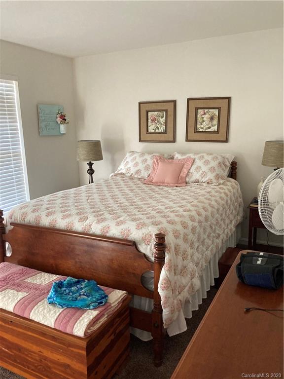 849 Dillard Road Rock Hill, SC 29730 - Photo 27 of 28 a bedroom with a bed and a painting on the wall