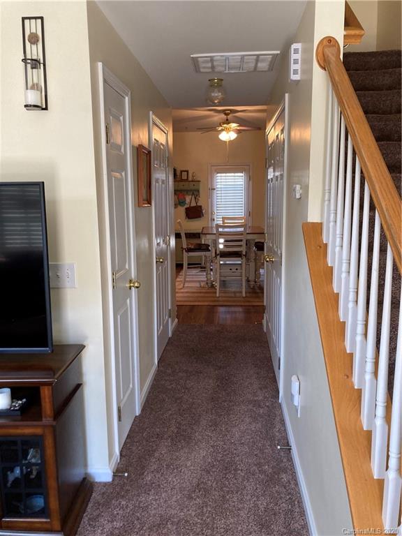 849 Dillard Road Rock Hill, SC 29730 - Photo 5 of 28 a view of a hallway with wooden floor and stairs