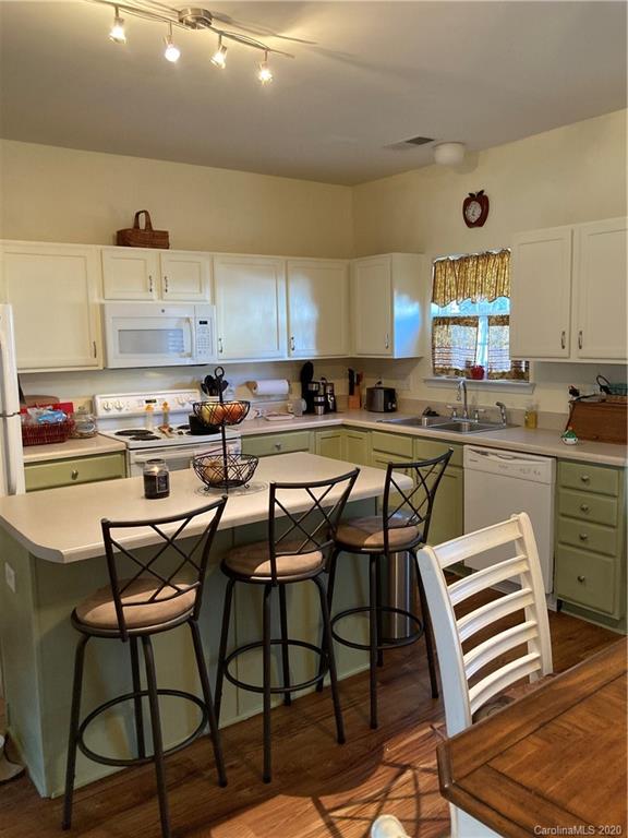 849 Dillard Road Rock Hill, SC 29730 - Photo 8 of 28 a kitchen with a table chairs stove and cabinets