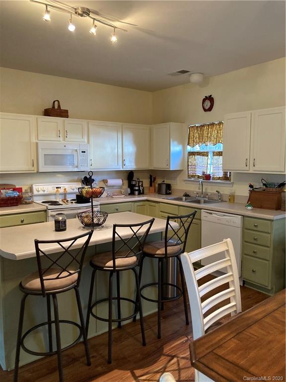 849 Dillard Road Rock Hill, SC 29730 - Photo 9 of 28 a kitchen with a stove a sink and cabinets