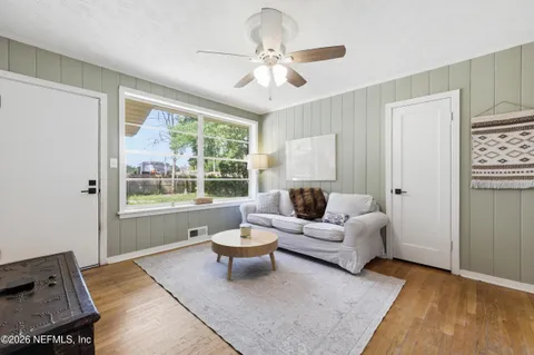 a living room with furniture and a window