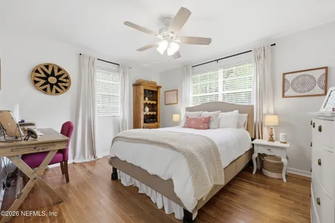 a bedroom with a bed and dresser