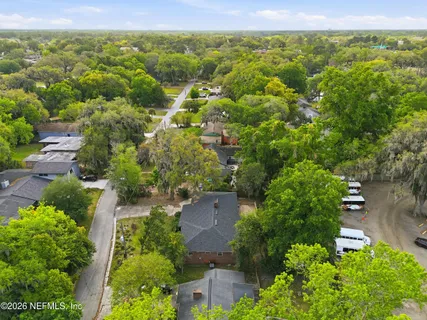 an aerial view of residential houses with outdoor space