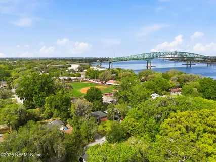 a view of a lake with houses in the back