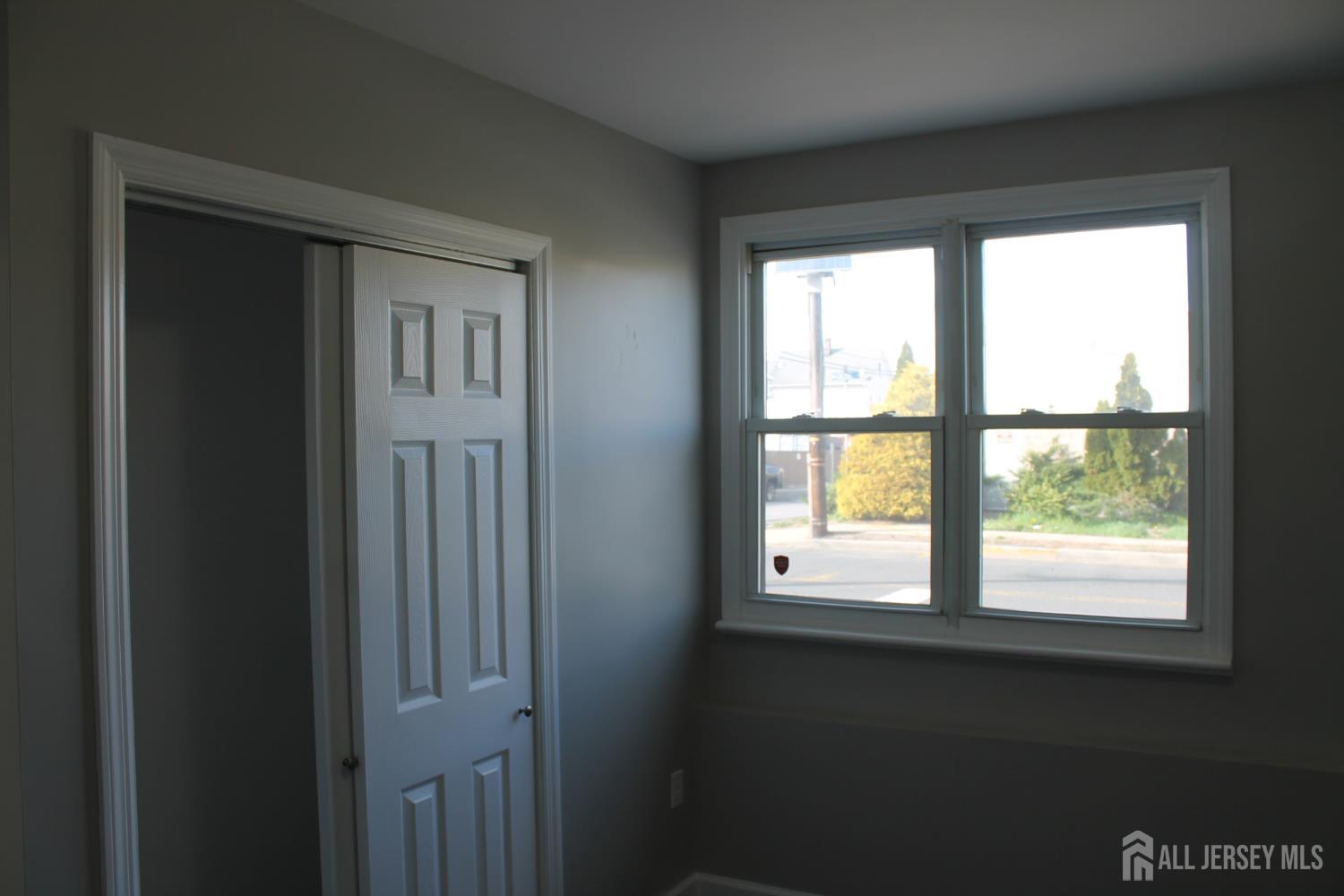 519 Roosevelt Avenue, Unit 2 Carteret, NJ 07008 - Photo 2 of 17 a view of an empty room with a window