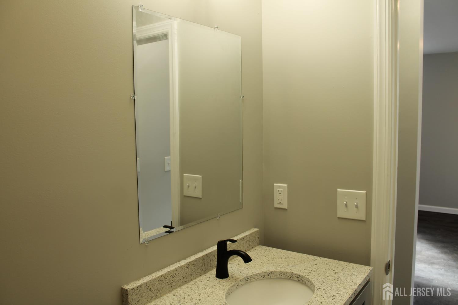 519 Roosevelt Avenue, Unit 2 Carteret, NJ 07008 - Photo 3 of 17 a bathroom with a sink