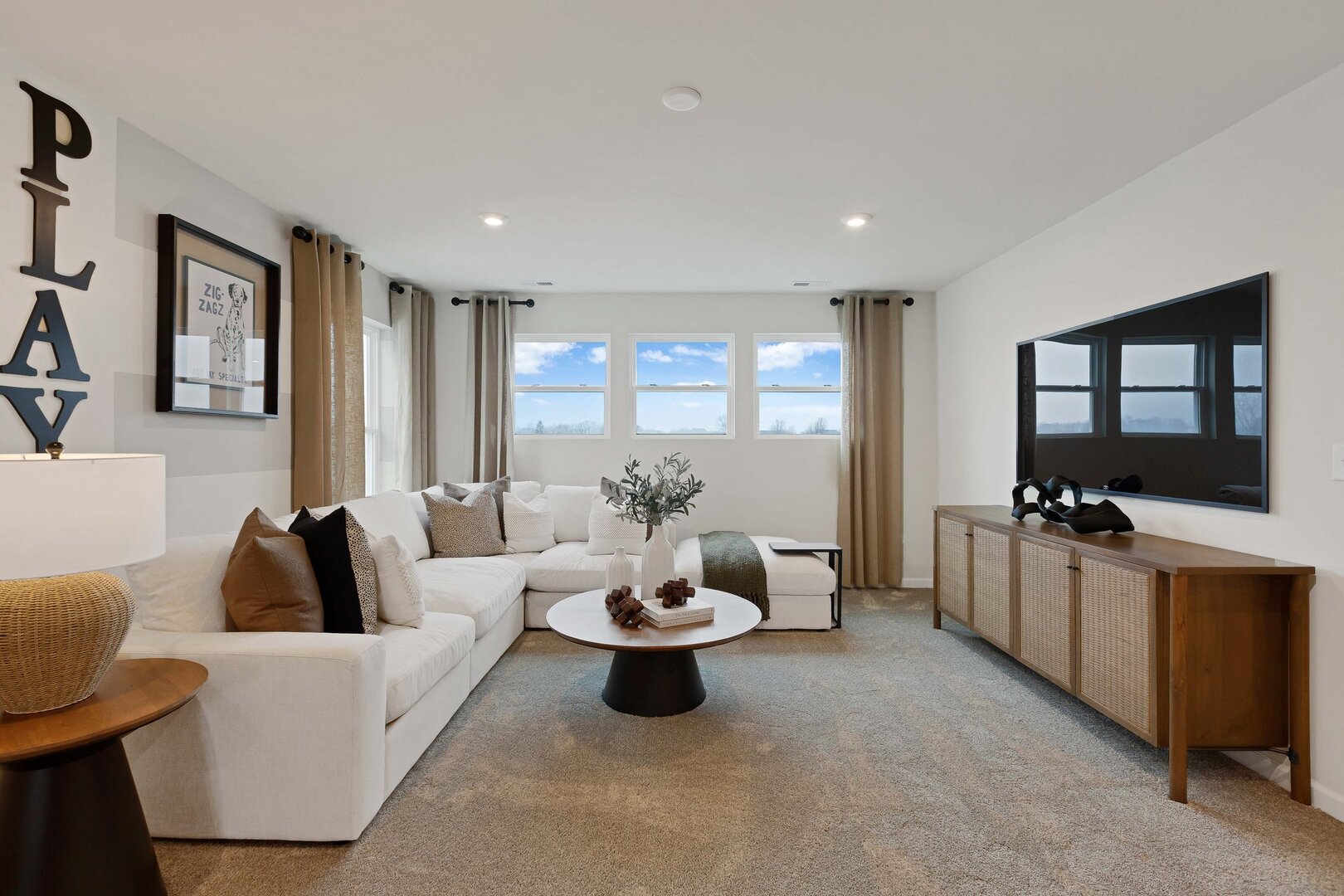 2539 Tailshot Road Plainfield, IL 60585 - Photo 14 of 14 a living room with furniture and a flat screen tv