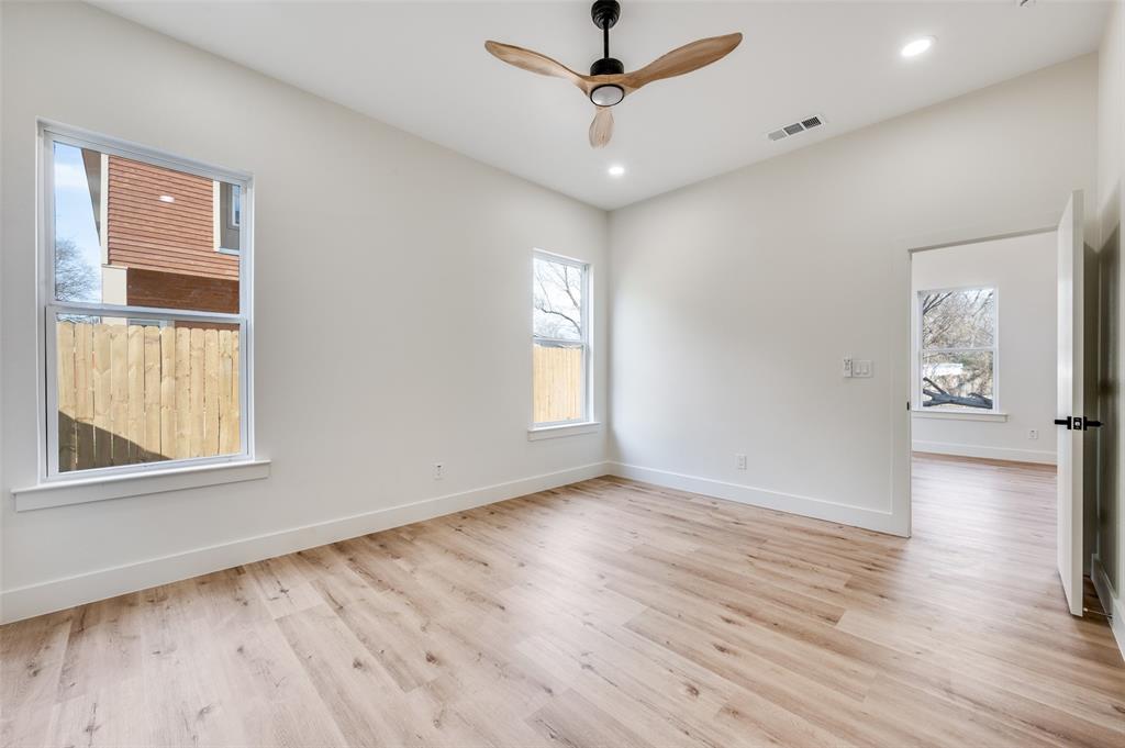 407 Bobbie Street Dallas, TX 75203 - Photo 11 of 25 wooden floor in an empty room with a window