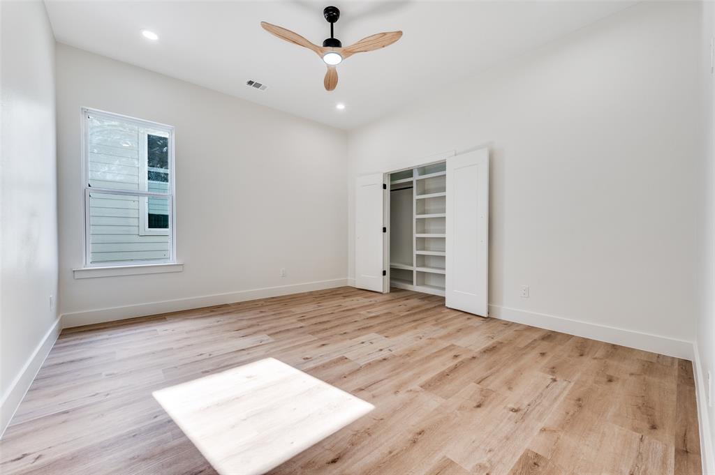 407 Bobbie Street Dallas, TX 75203 - Photo 15 of 25 wooden floor in an empty room with a window