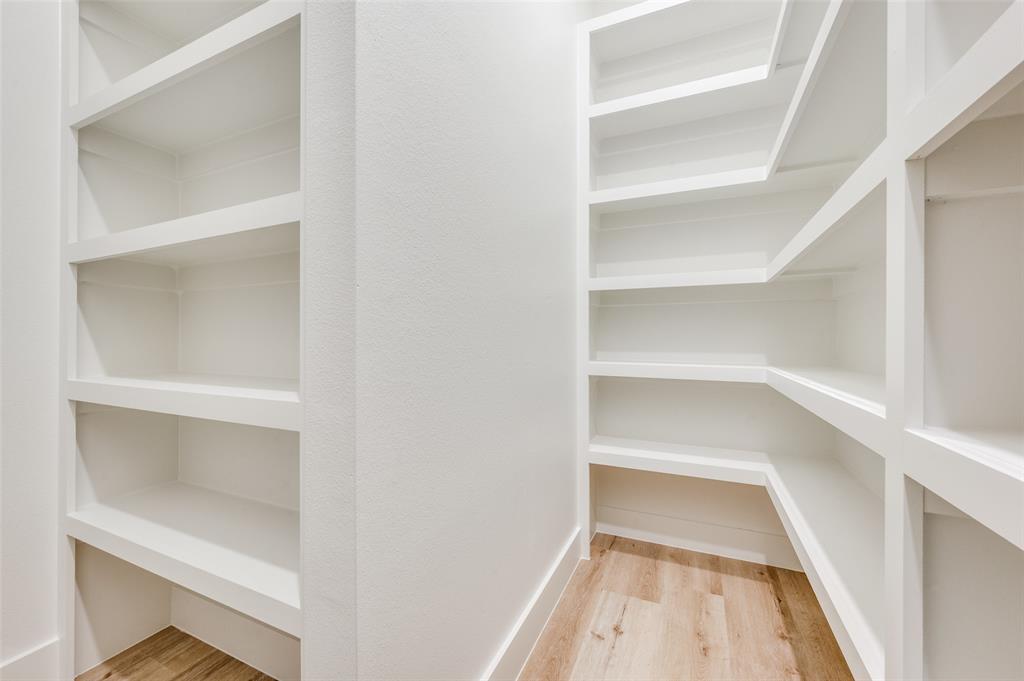 407 Bobbie Street Dallas, TX 75203 - Photo 20 of 25 a view of walk in closet with empty racks