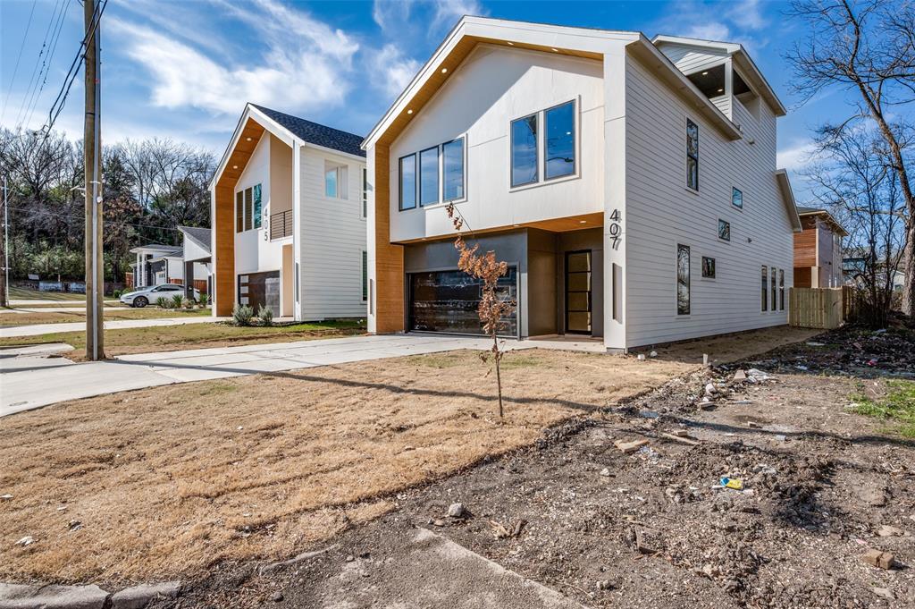 407 Bobbie Street Dallas, TX 75203 - Photo 2 of 25 a front view of a house with a yard