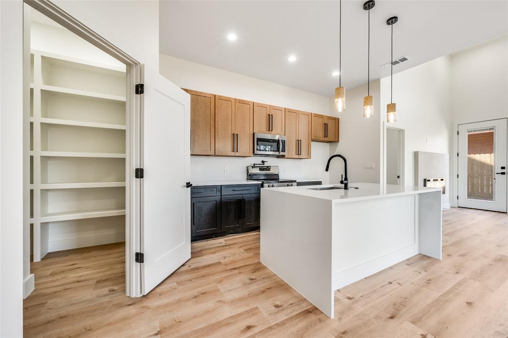 407 Bobbie Street Dallas, TX 75203 - Photo 5 of 25 a view of kitchen with stainless steel appliances sink refrigerator and stove