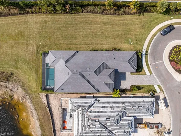 an aerial view of a house with a ocean view