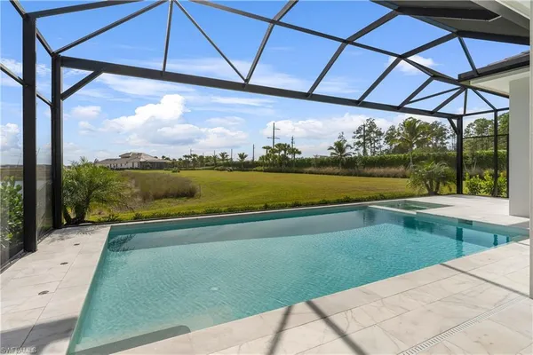 a view of swimming pool with a yard