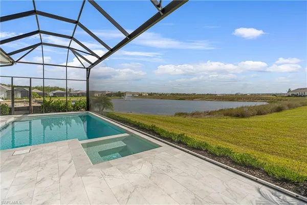 a view of a swimming pool with a lounge chair