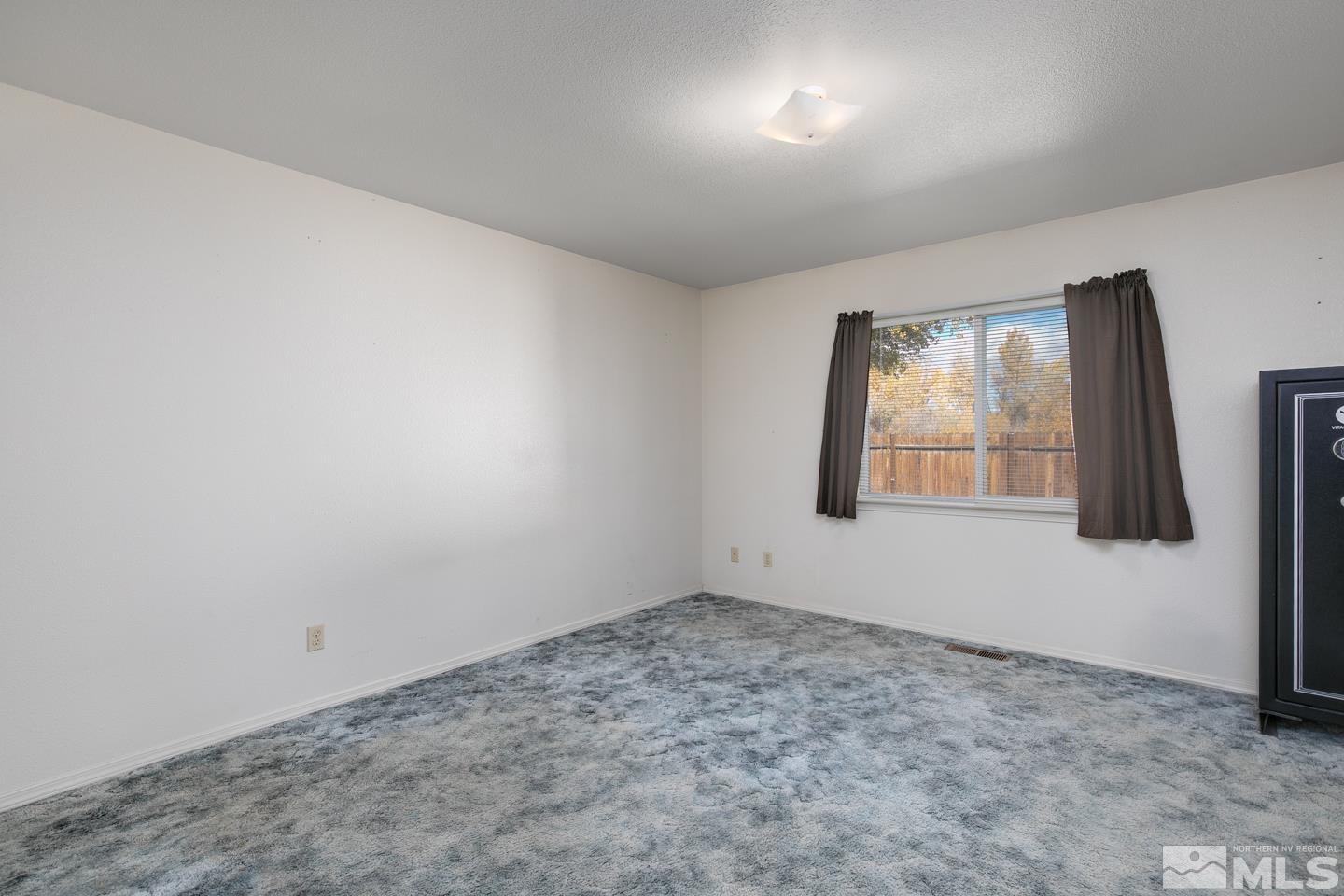 1300 Lattin Road Fallon, NV 89406 - Photo 13 of 26 an empty room with windows