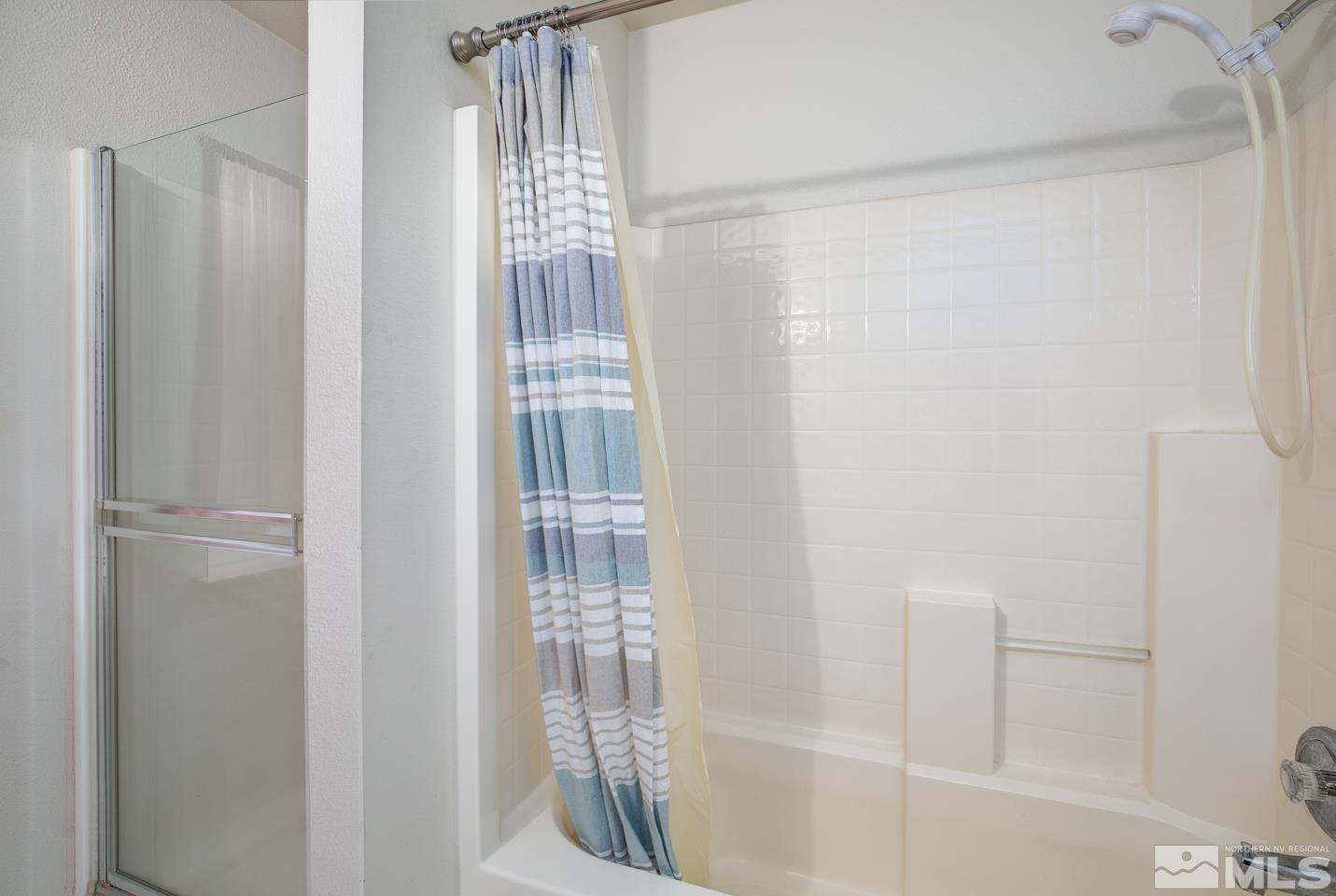 1300 Lattin Road Fallon, NV 89406 - Photo 15 of 26 a bathroom with a shower and a window