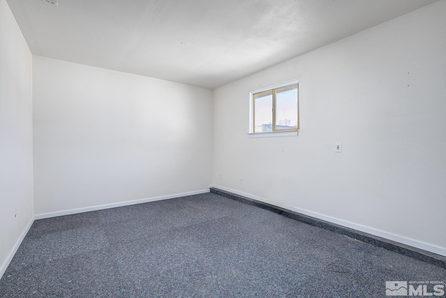 1300 Lattin Road Fallon, NV 89406 - Photo 17 of 26 a view of an empty room with a window