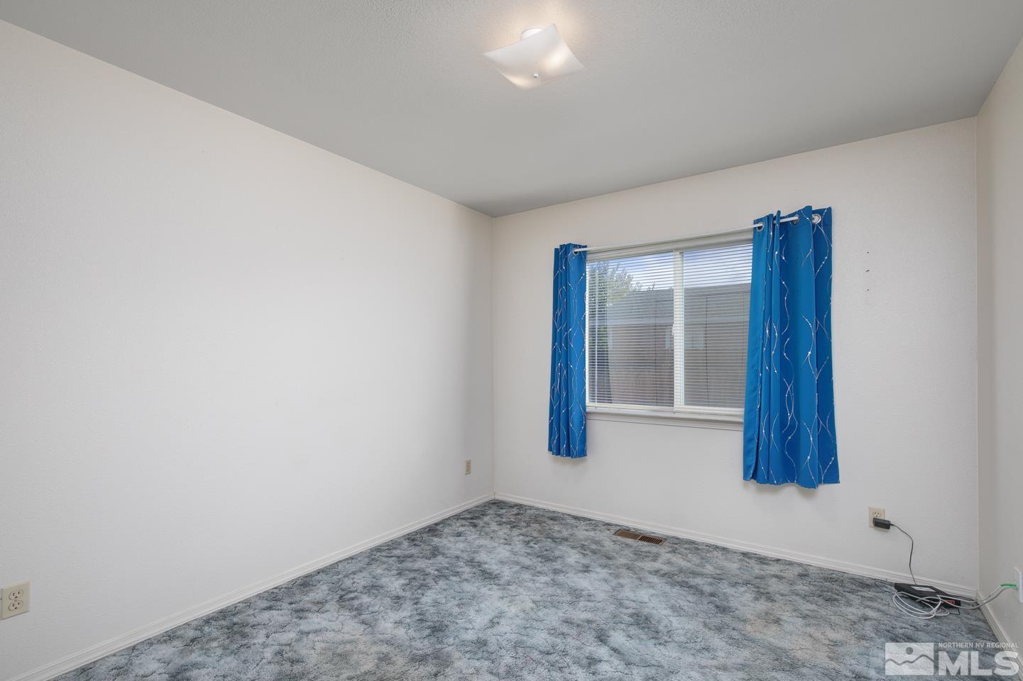 1300 Lattin Road Fallon, NV 89406 - Photo 9 of 26 a view of an empty room and window