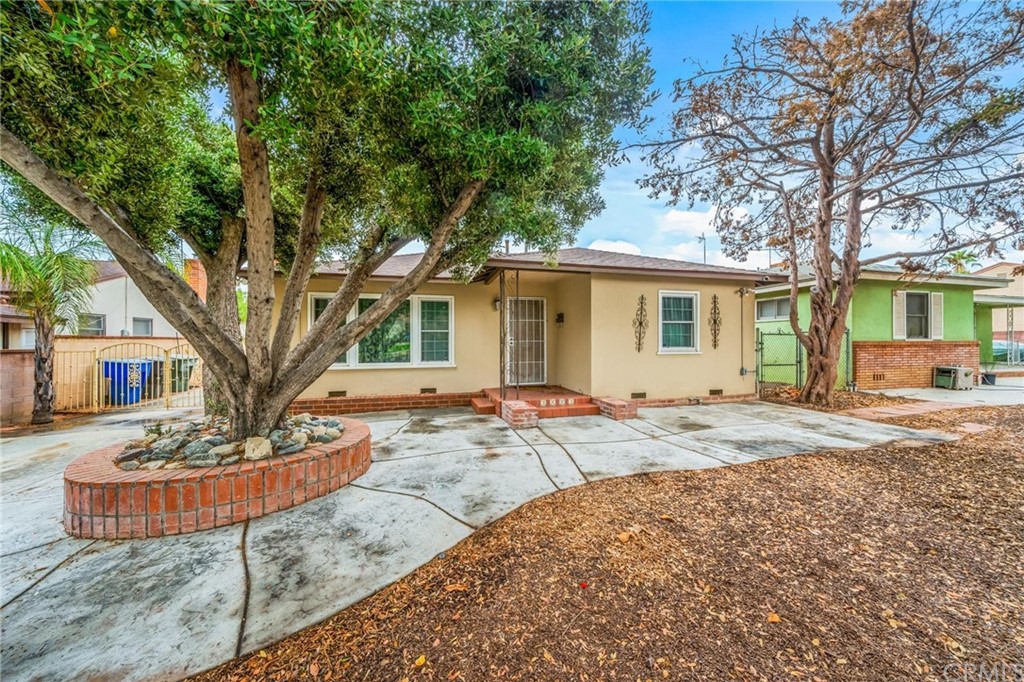 3663 Harding Street Riverside, CA 92506 - Photo 1 of 1 a view of a house with a yard and garage