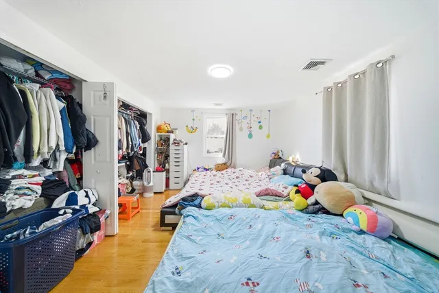 a bed room with a bed and a walk in closet