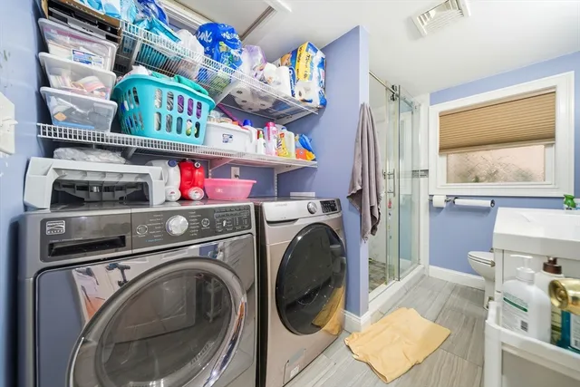 a utility room with dryer and washer