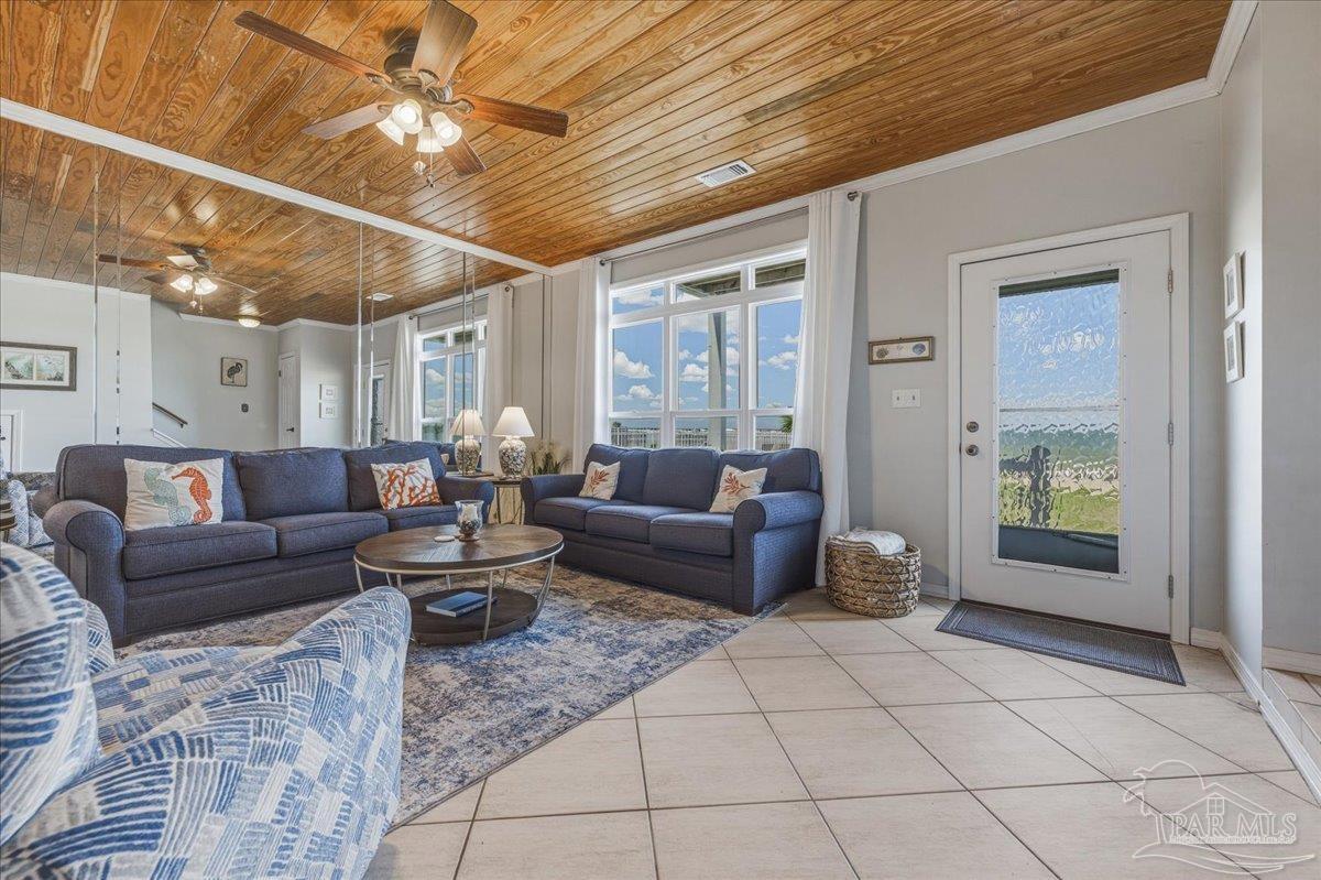 26063 Canal Road, Unit 3F Orange Beach, AL 36561 - Photo 16 of 72 a living room with furniture and a chandelier