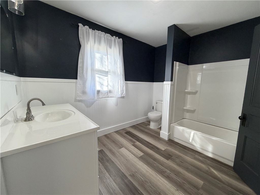 230 West Decatur Street Eaton, OH 45320 - Photo 8 of 22 This newly updated bath features a clean aesthetic with modern flooring and a classic vanity.