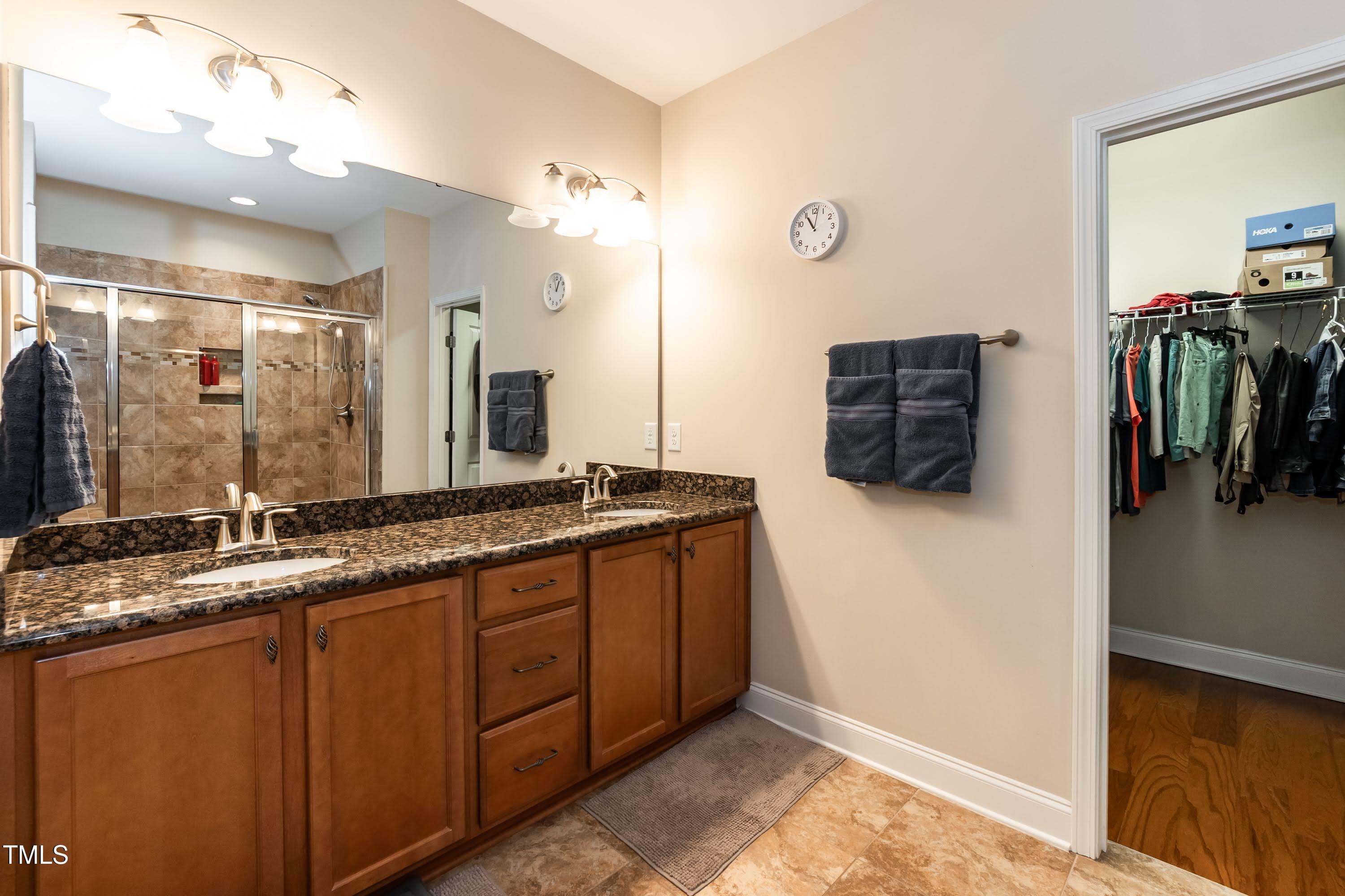 7660 Channery Way Raleigh, NC 27616 - Photo 18 of 42 a bathroom with a sink and a mirror